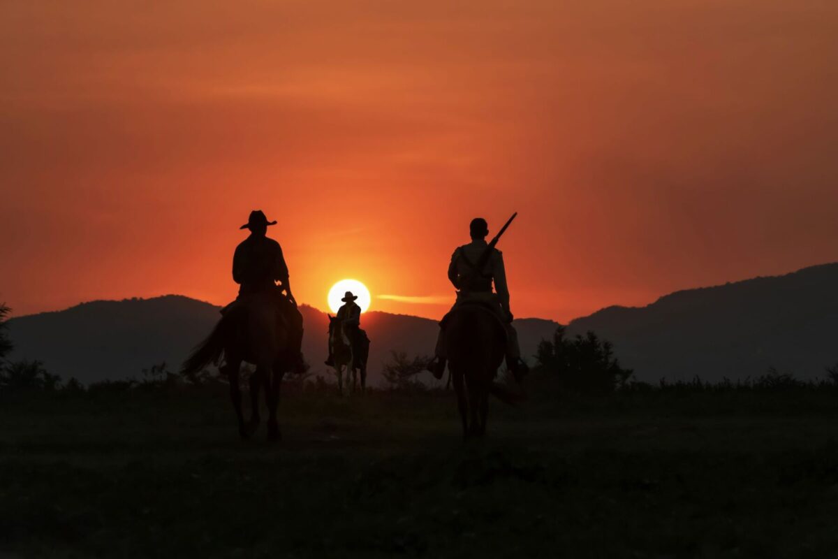 cowboys in the sunset